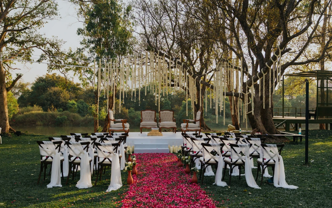 A riverside ceremony with a petal aisle
