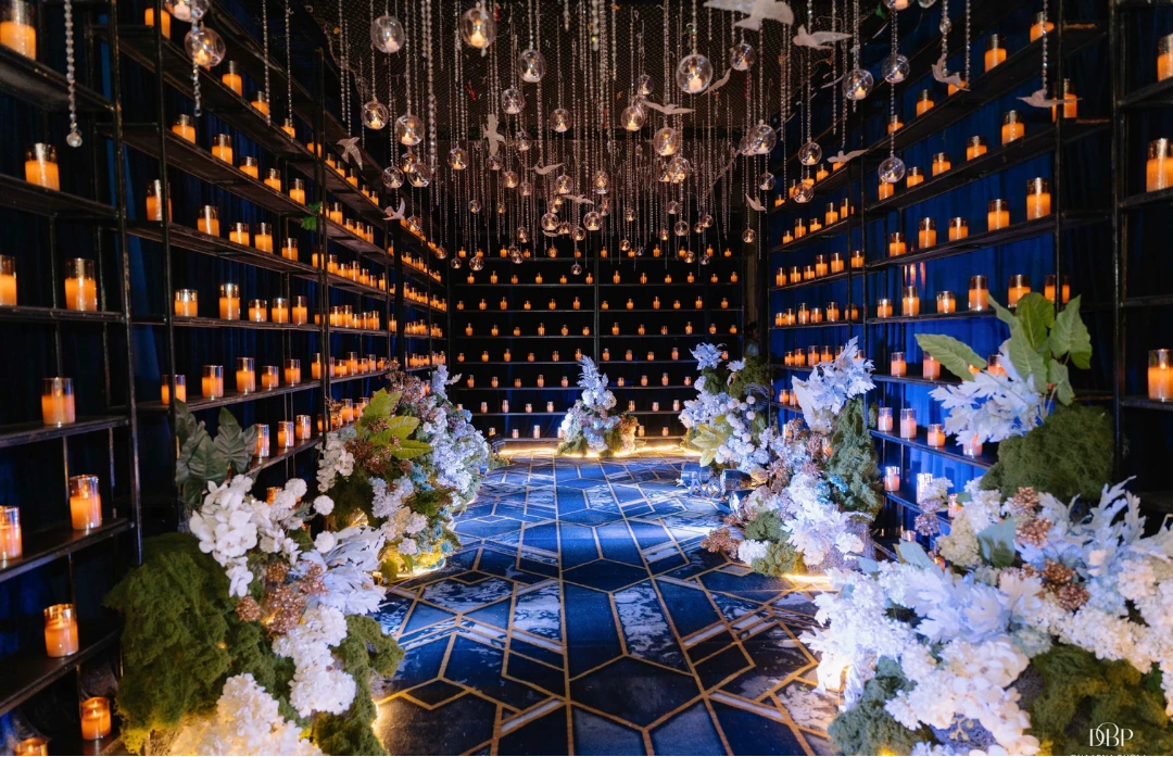 A candlelit corridor in indigo