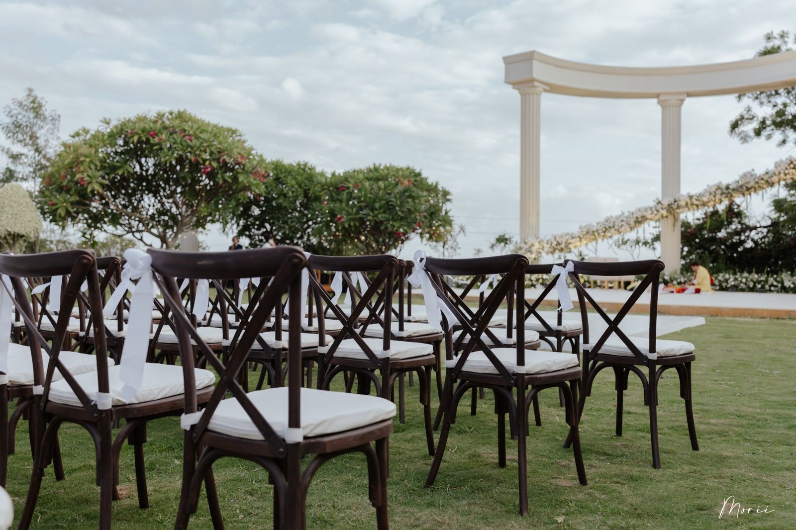 Crossback chairs set for a lawn ceremony