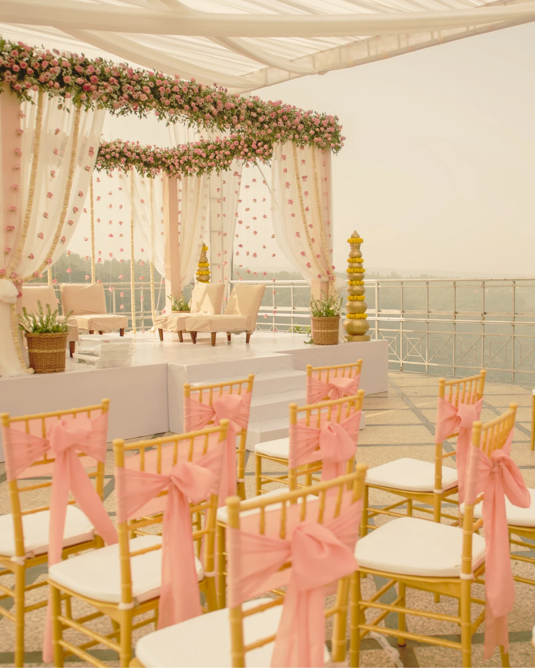 A rose mandap on a terrace — Gātha