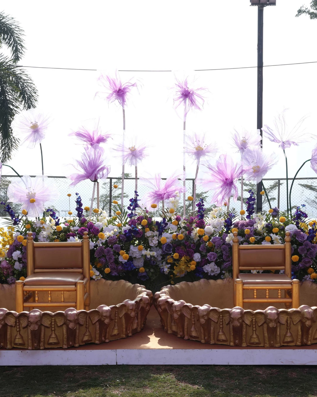 A feathered floral stage in lilac